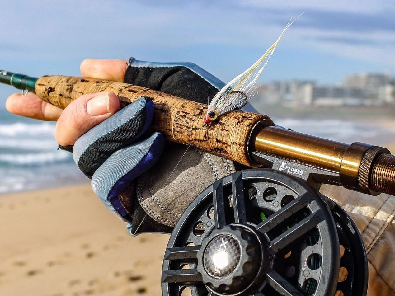 Premium fishing rods displayed on wooden rack